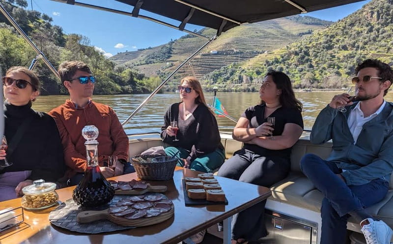 From Porto: Tastings at 2 Wineries, Chef's Lunch & Boat Tour - A private Douro boat cruise, with snacks, drinks, and stories