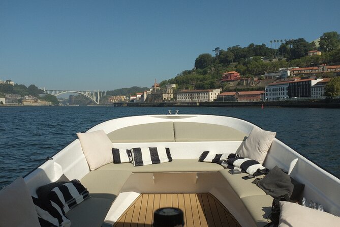 Porto: Douro River Boat Cruise with Port Wine and Snacks - Ribeira and São Francisco Church views from the river