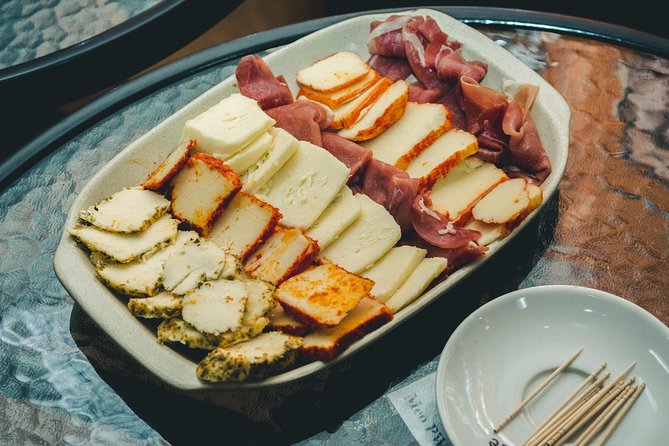 Porto Food and Local Drinks Evening Tour by Food Lover Tour - Traditional bars, walk-and-talk history, and why the atmosphere matters