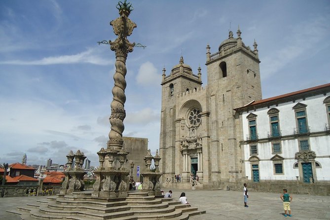 Porto Full Day City Tour Wine Tasting and Six Bridges Cruise - Porto Cathedral: exterior views and city-wall vibes