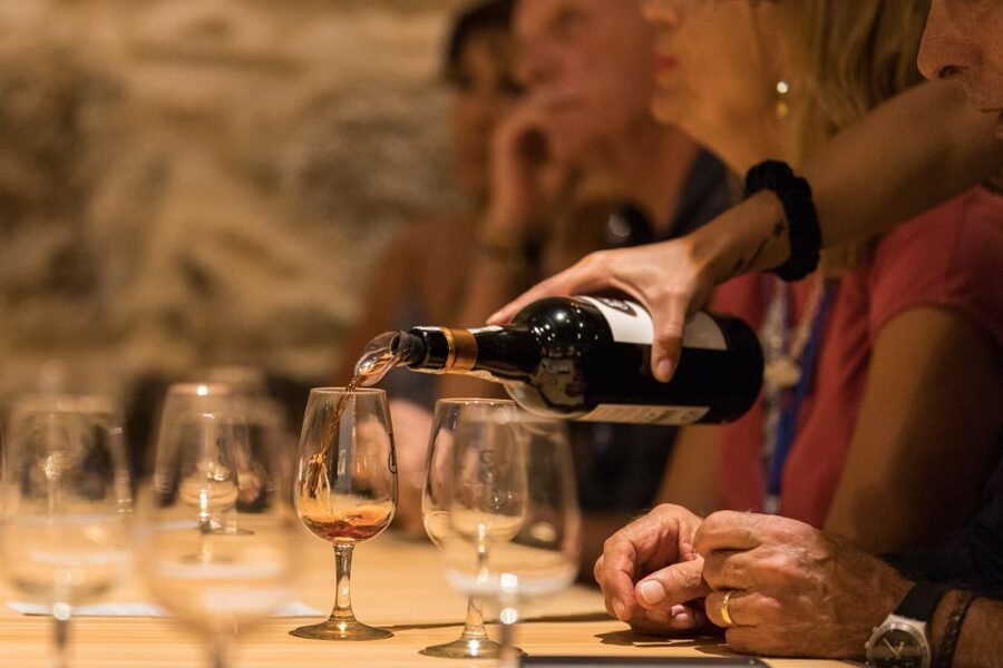 Porto: Guided Tour and Tasting of 3 Port Wines at Poças - Entering the ageing cellar: where the century-matured magic happens