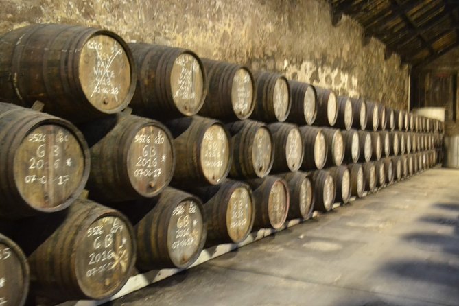 Porto: Port and Douro Wine Walking Tour With 9 Wine Tastings - Stop 3 at Fonseca Porto: a cellar visit plus classic Port education