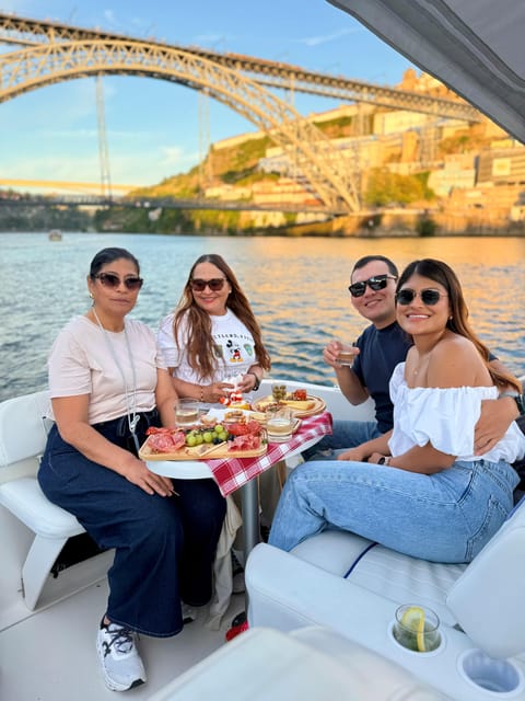 Porto: Private Douro River Bridges Cruise with Food & Wine - Food board and a Portuguese wine tasting on board