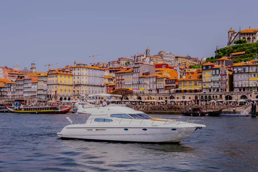 Porto: Private Yacth Cruise with Wine, Snacks & 6 Bridges - Porto and Gaia from the river: Clérigos Tower and the Cathedral make sense fast
