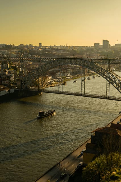 Porto: Sunset Walking Tour with Port Wine Tasting - Walking through Porto’s historic streets with a real guide