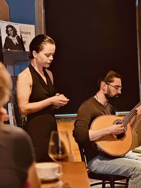 Porto: Traditional Fado Show with Welcome Drink - Portuguese wine that supports the concert, not hijacks it