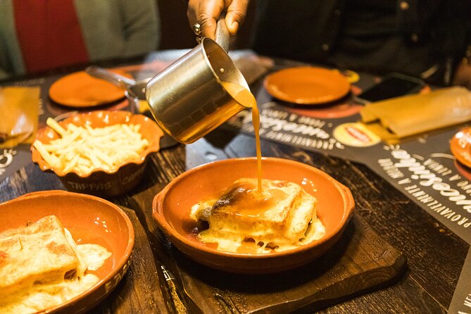Porto Wine & Dine: Port Wine Cave Food Tour with Eating Europe - Streets of Porto: Rua Cândido dos Reis and bacalhau