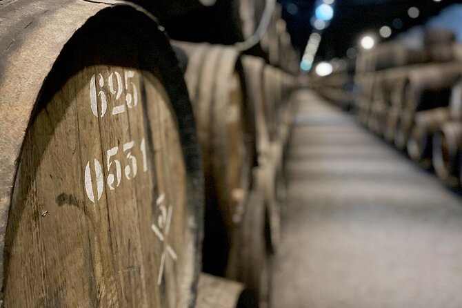 Wine Tasting with Tapas Walking Tour in Porto - Quinta dos Corvos: your Port start, two samples, and a real cellar visit